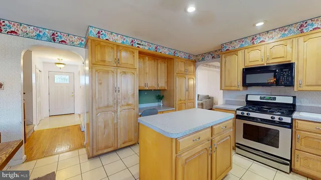 a kitchen that has a stove and a microwave