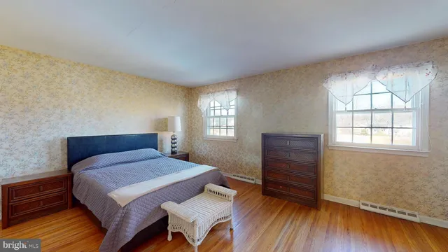 a bedroom with a bed and a desk