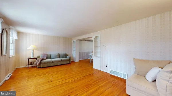 a bedroom with a bed and lamp