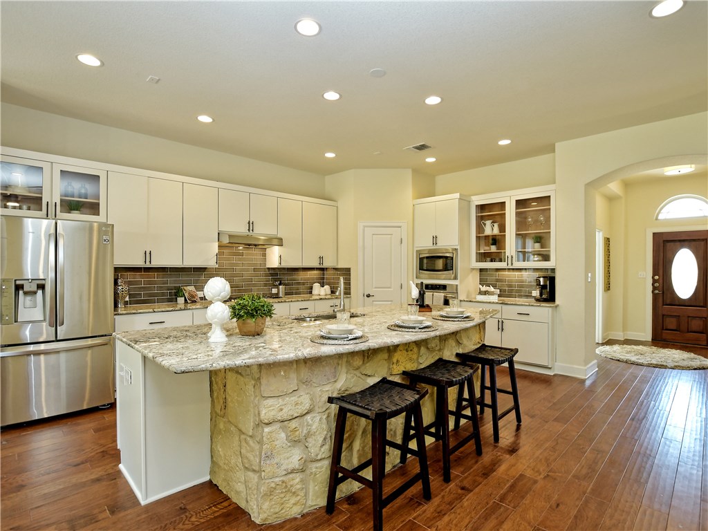 5417 Cherokee Draw Road Austin, TX 78738 - Photo 1 of 1 Beautiful David Weekley Home features a modern farmhouse style kitchen.