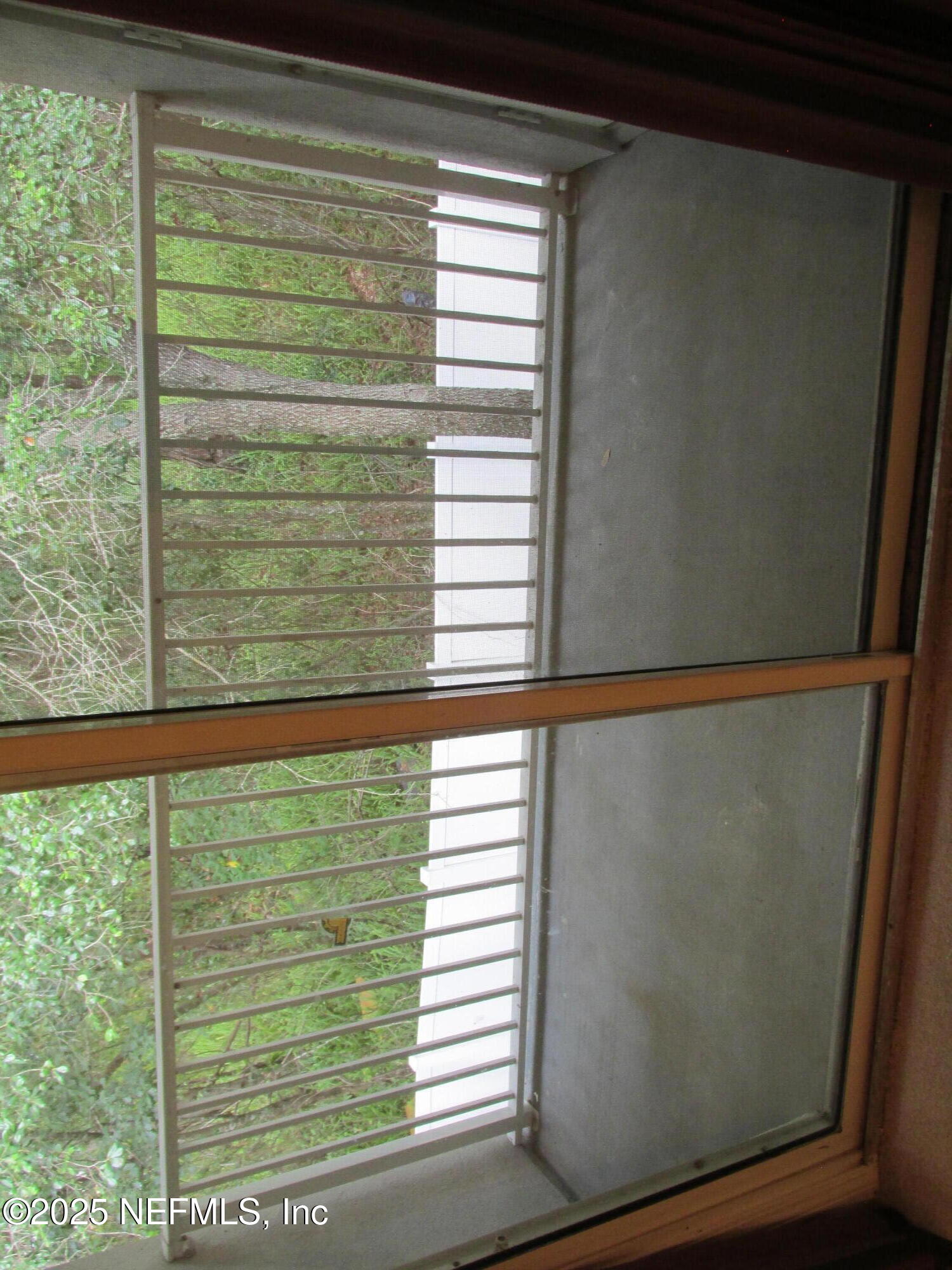 6057 Maggies Circle, Unit 114 Jacksonville, FL 32244 - Photo 28 of 28 a view of a window of a house