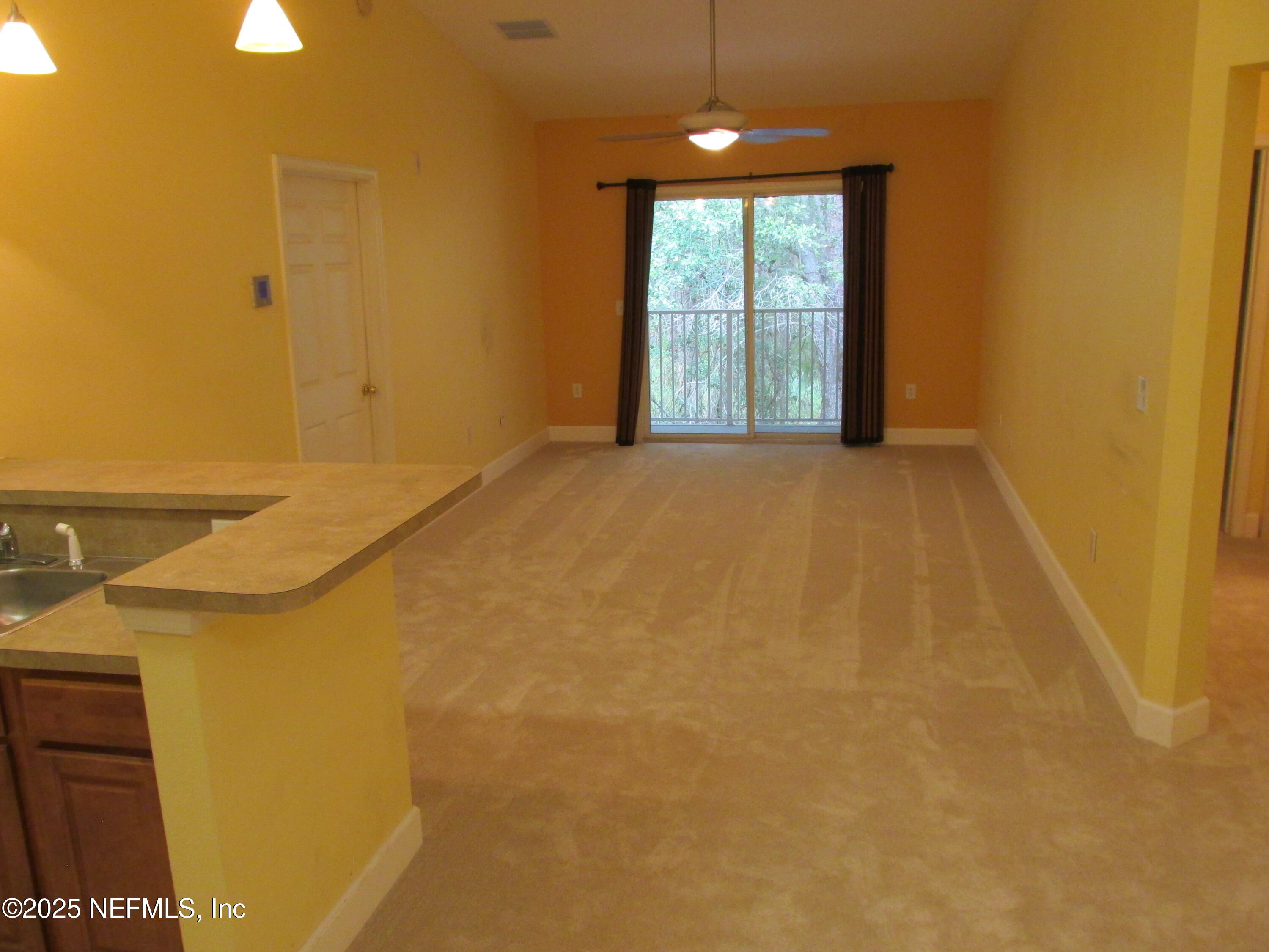 6057 Maggies Circle, Unit 114 Jacksonville, FL 32244 - Photo 9 of 28 a view of an empty room with a window