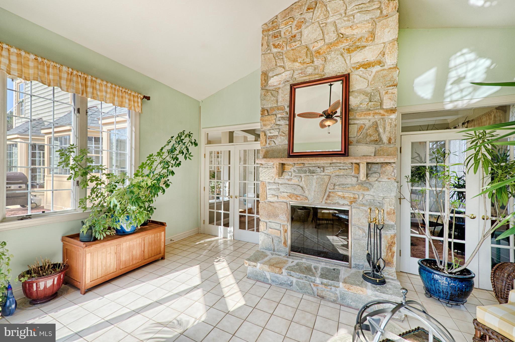 1629 Providence Road Towson, MD 21286 - Photo 18 of 30 a living room with furniture a fireplace and a large window