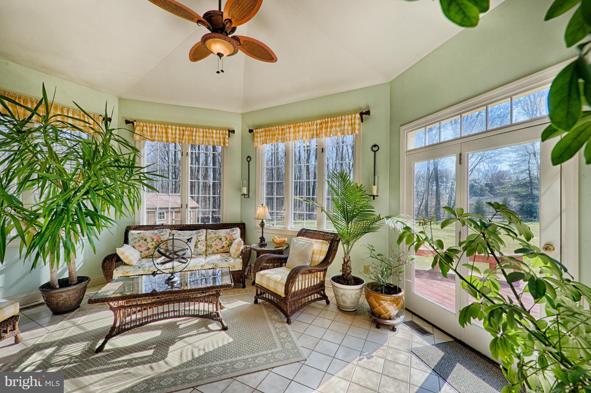 1629 Providence Road Towson, MD 21286 - Photo 19 of 30 a living room with patio furniture and a potted plant
