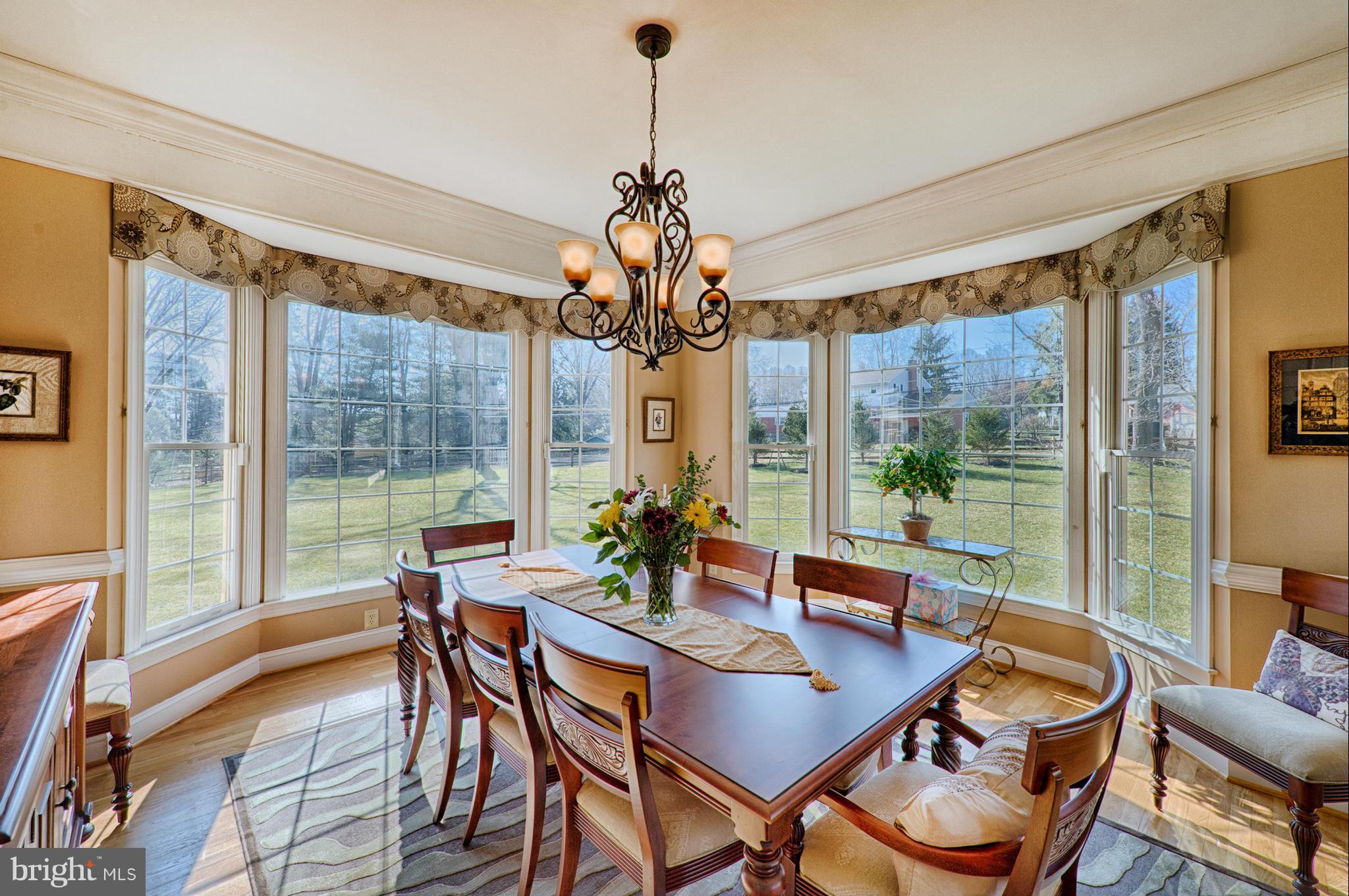 1629 Providence Road Towson, MD 21286 - Photo 5 of 30 a dining room with furniture a chandelier and wooden floor