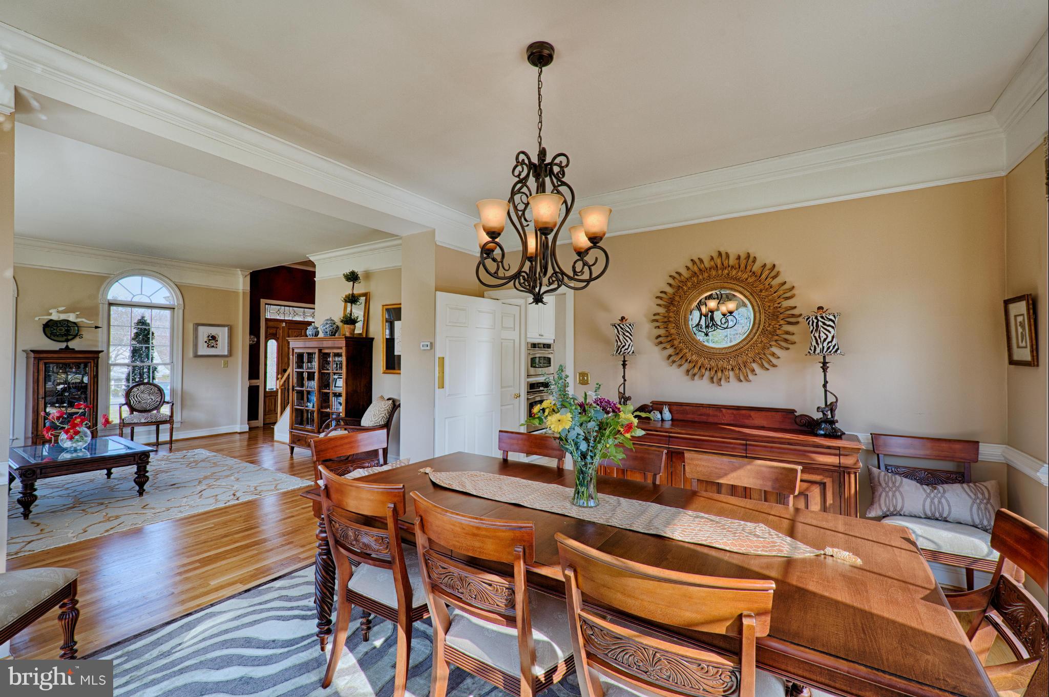 1629 Providence Road Towson, MD 21286 - Photo 6 of 30 a dining room with wooden floor and chandelier
