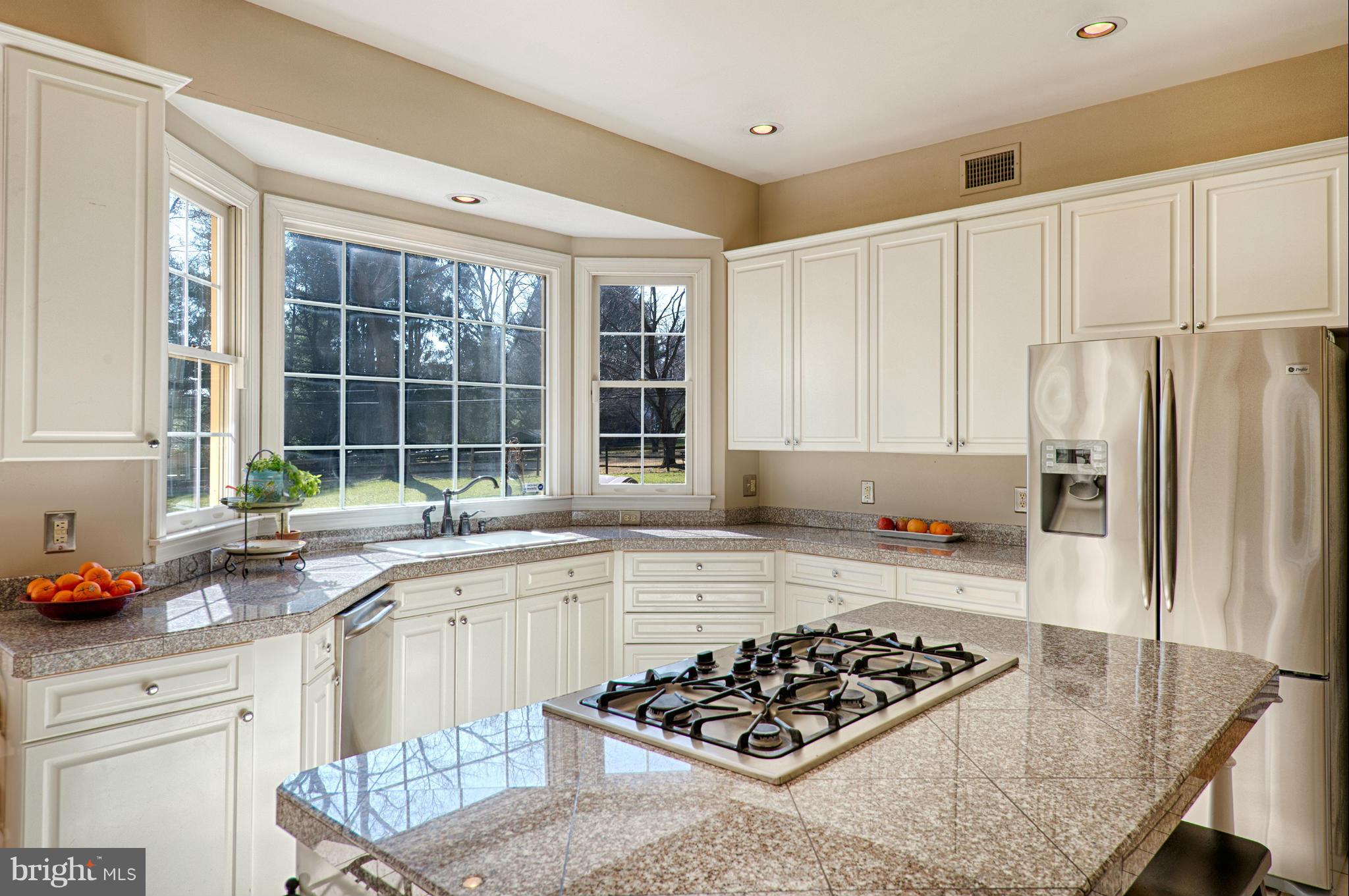 1629 Providence Road Towson, MD 21286 - Photo 8 of 30 a kitchen with a stove a sink and a refrigerator
