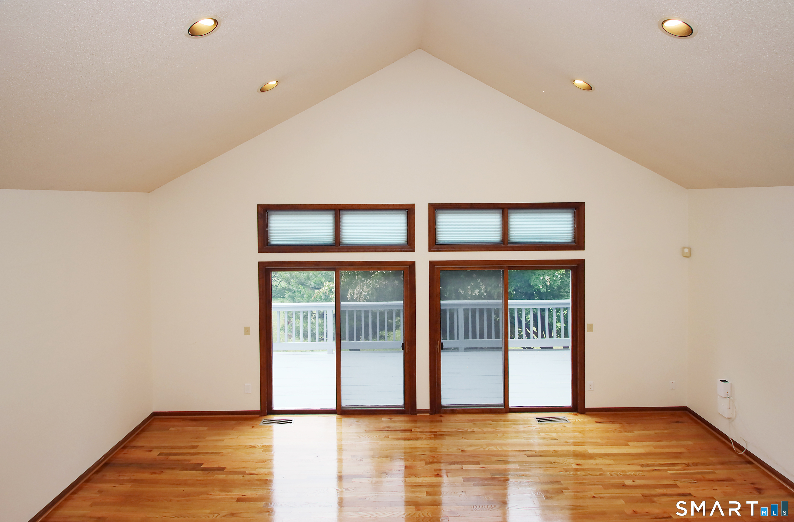 352 Center Street Wolcott, CT 06716 - Photo 16 of 40 a view of an empty room with wooden floor and a window
