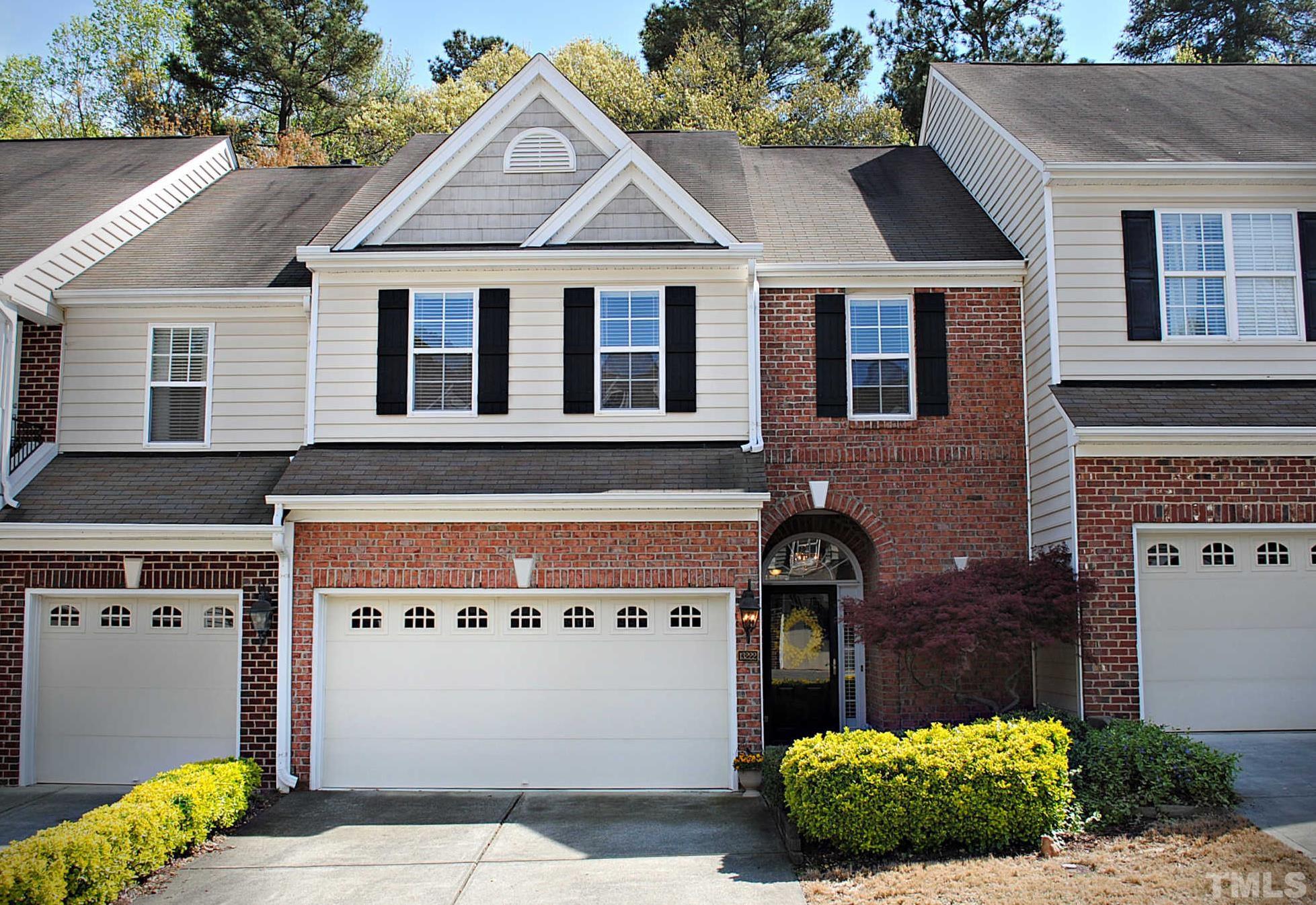 13222 Ashford Park Drive Raleigh, NC 27613 - Photo 1 of 30 a front view of a house with a garden