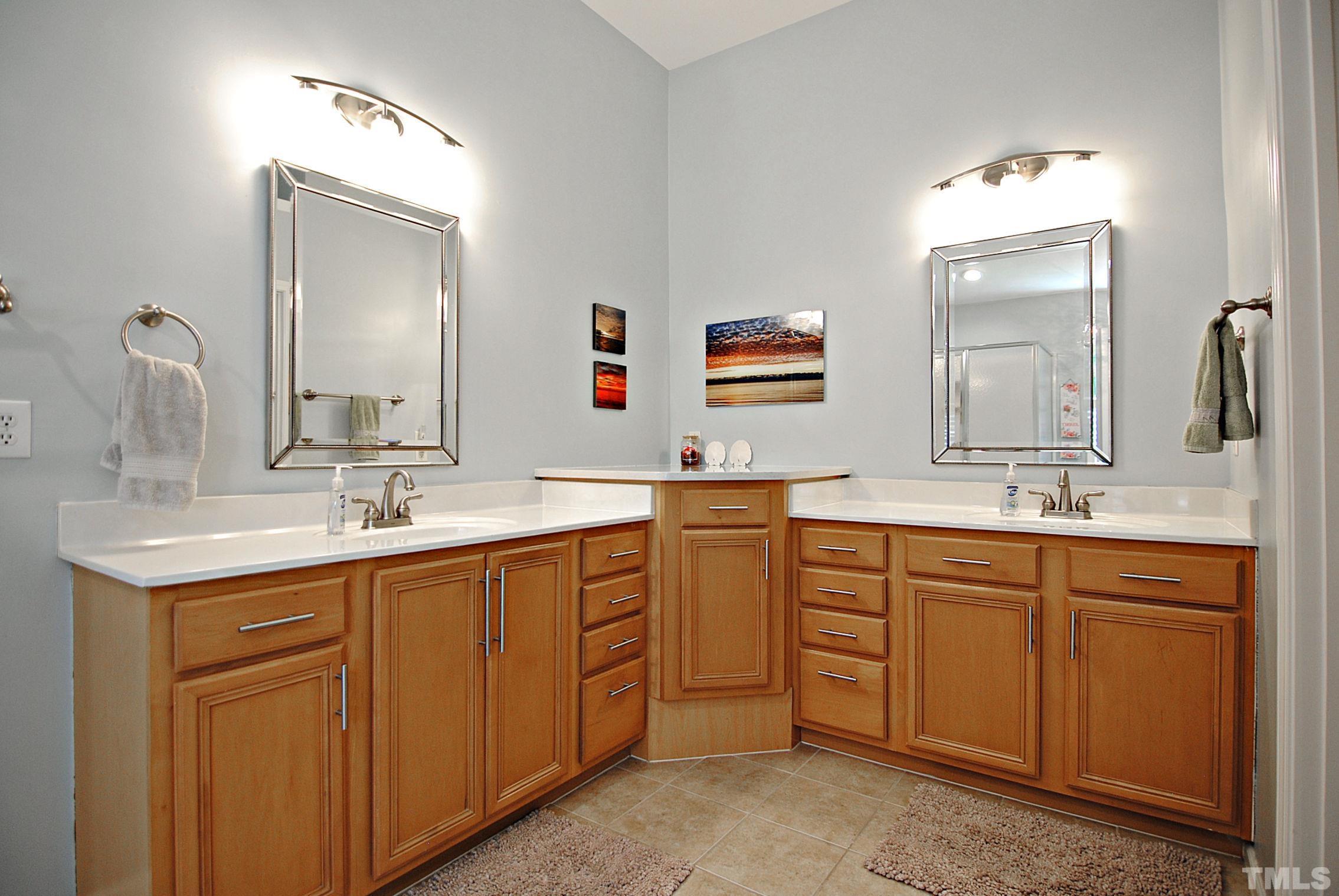 13222 Ashford Park Drive Raleigh, NC 27613 - Photo 18 of 30 a bathroom with a double vanity sink double and mirror