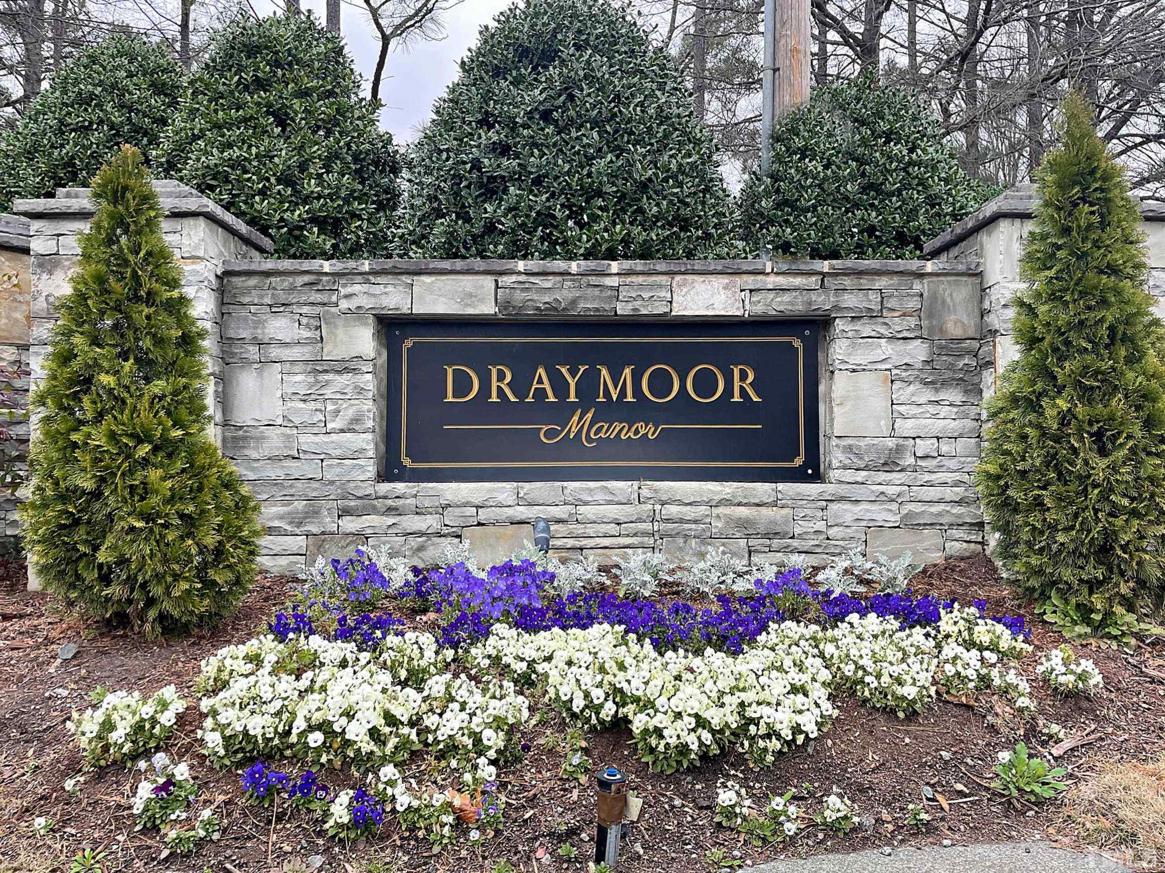 13222 Ashford Park Drive Raleigh, NC 27613 - Photo 30 of 30 a sign that is in front of flowers