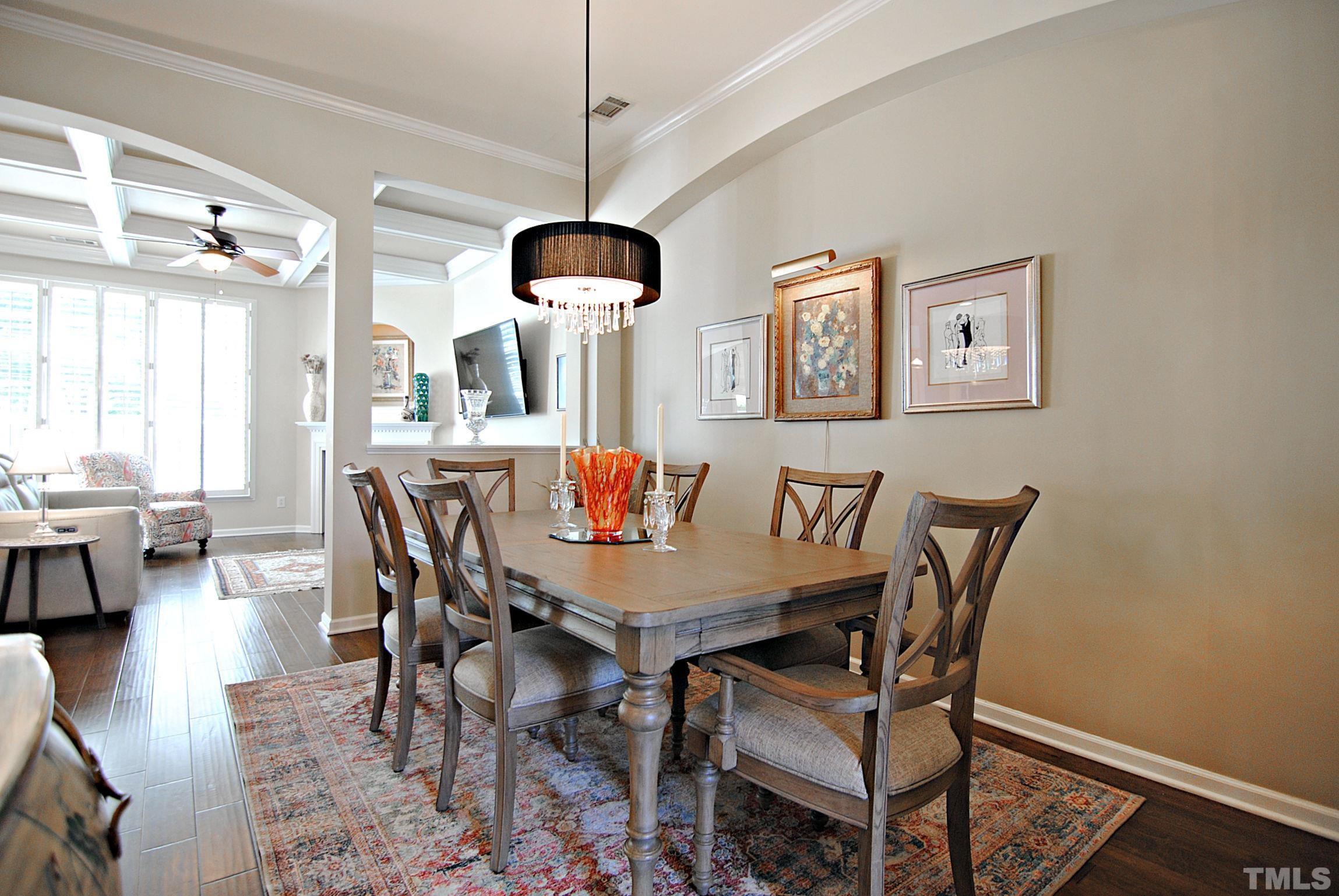 13222 Ashford Park Drive Raleigh, NC 27613 - Photo 6 of 30 a view of a dining room with furniture window and wooden floor