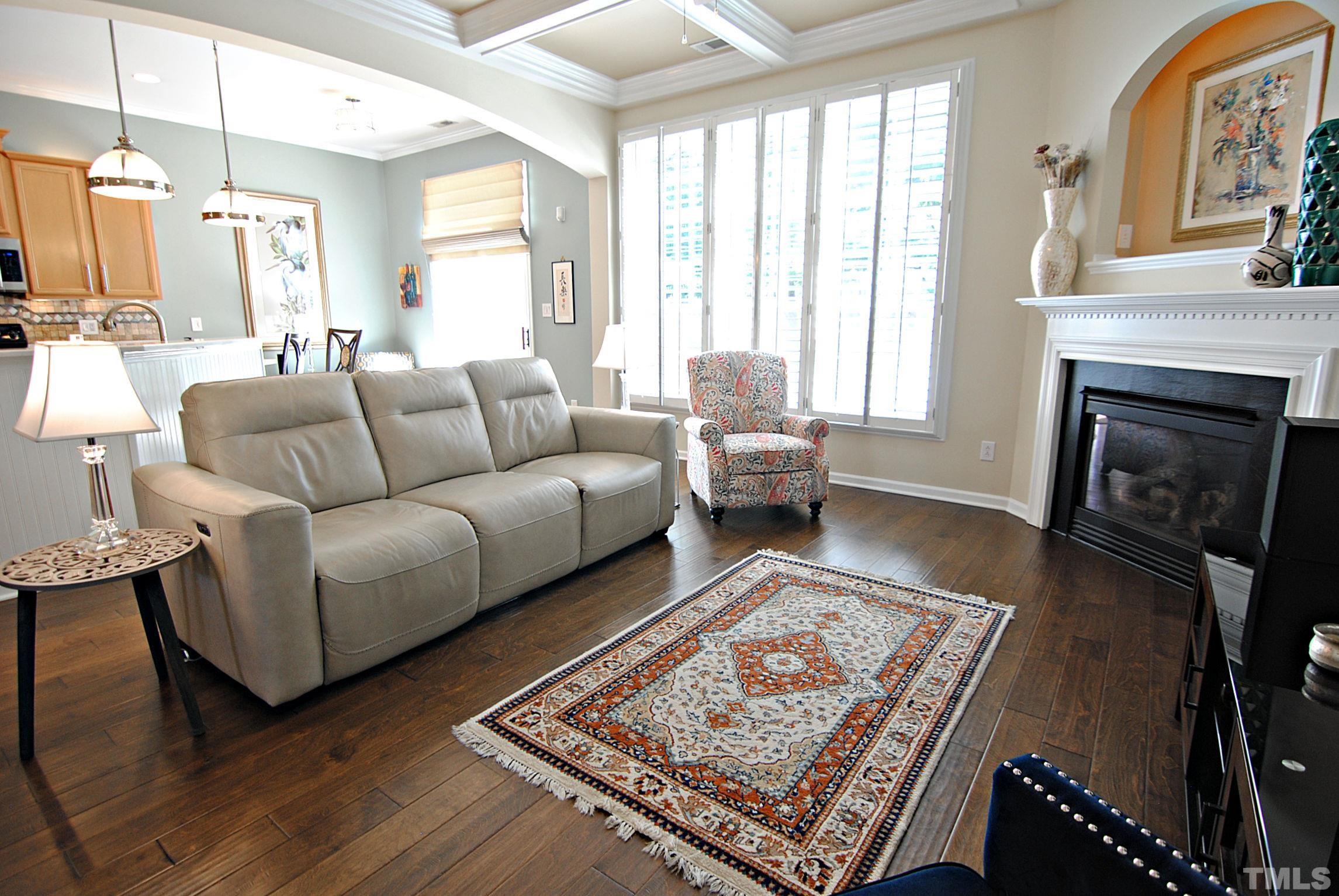 13222 Ashford Park Drive Raleigh, NC 27613 - Photo 10 of 30 a living room with furniture or couch and a fireplace