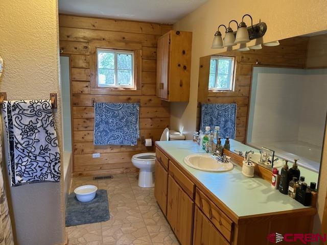 21330 Rd V.6 Lewis, CO 81327 - Photo 12 of 30 a bathroom with a granite countertop sink and a mirror
