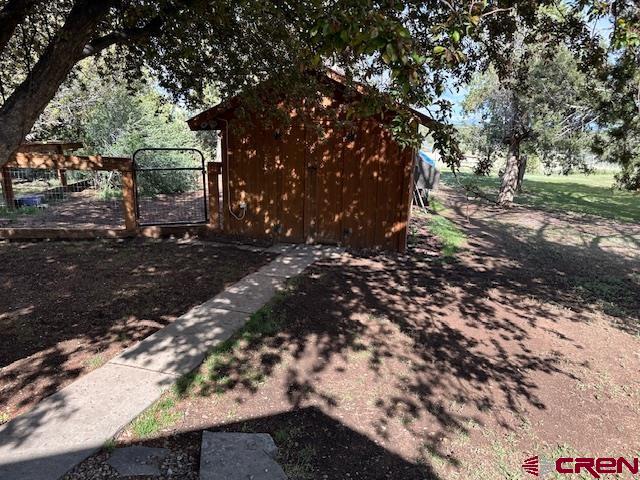 21330 Rd V.6 Lewis, CO 81327 - Photo 15 of 30 a view of a yard with trees