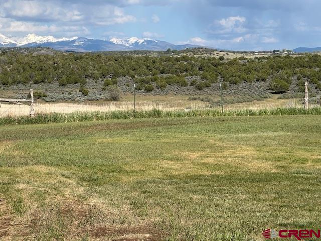 21330 Rd V.6 Lewis, CO 81327 - Photo 19 of 30 a view of a lake with a mountain