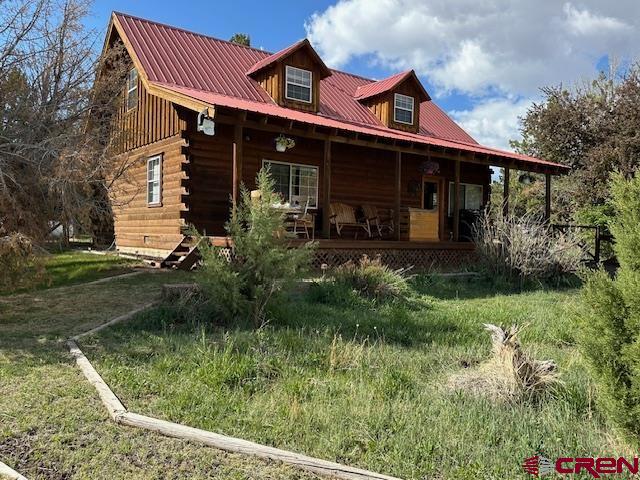 21330 Rd V.6 Lewis, CO 81327 - Photo 25 of 30 a front view of house with yard and green space