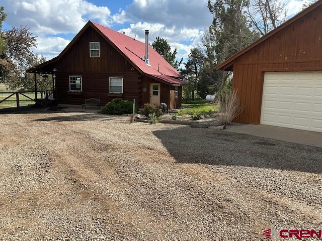 21330 Rd V.6 Lewis, CO 81327 - Photo 4 of 30 a front view of a house with a yard