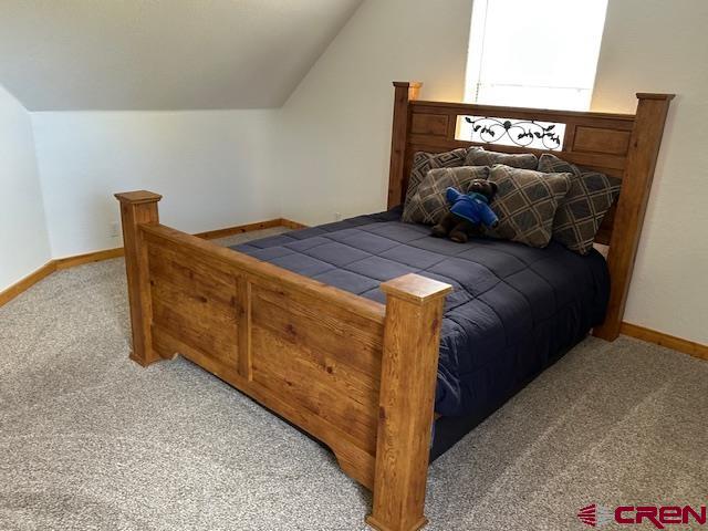 21330 Rd V.6 Lewis, CO 81327 - Photo 10 of 30 a bedroom with a bed and a night stand