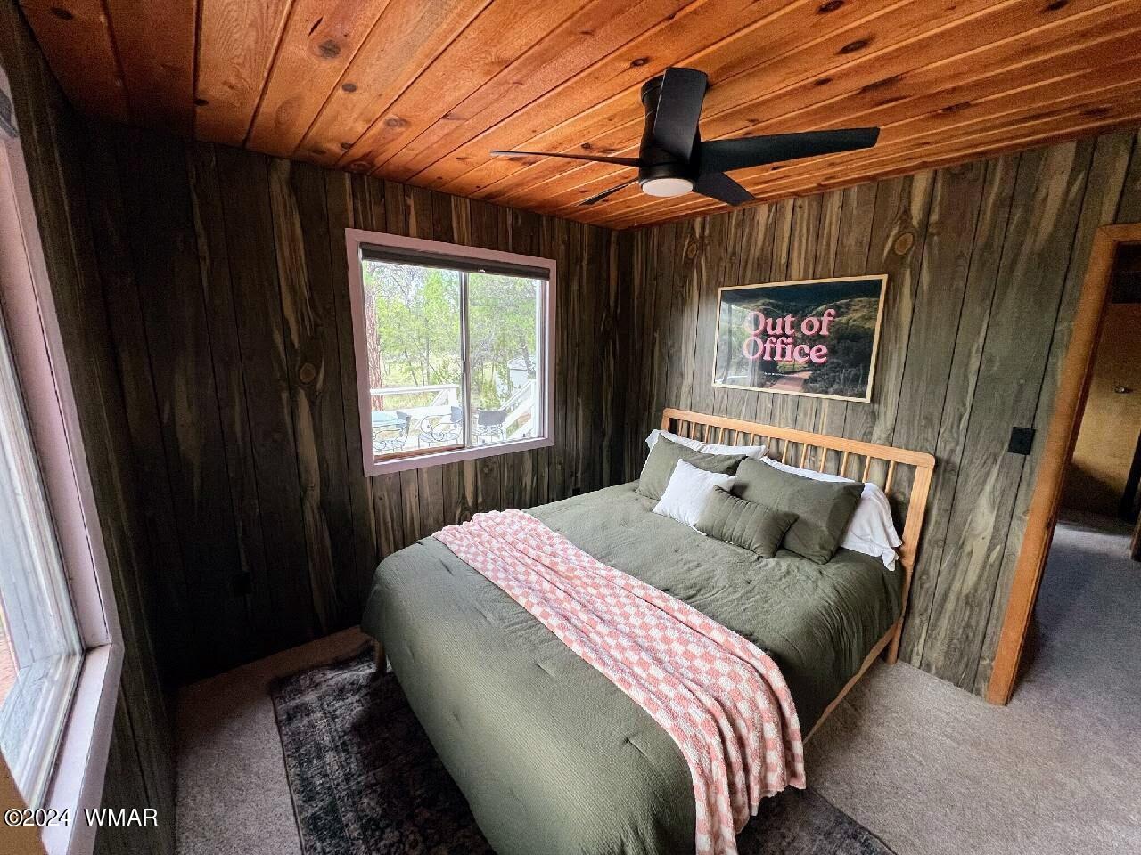 3058 Aspen Road Overgaard, AZ 85933 - Photo 5 of 15 a bedroom with a bed and a window
