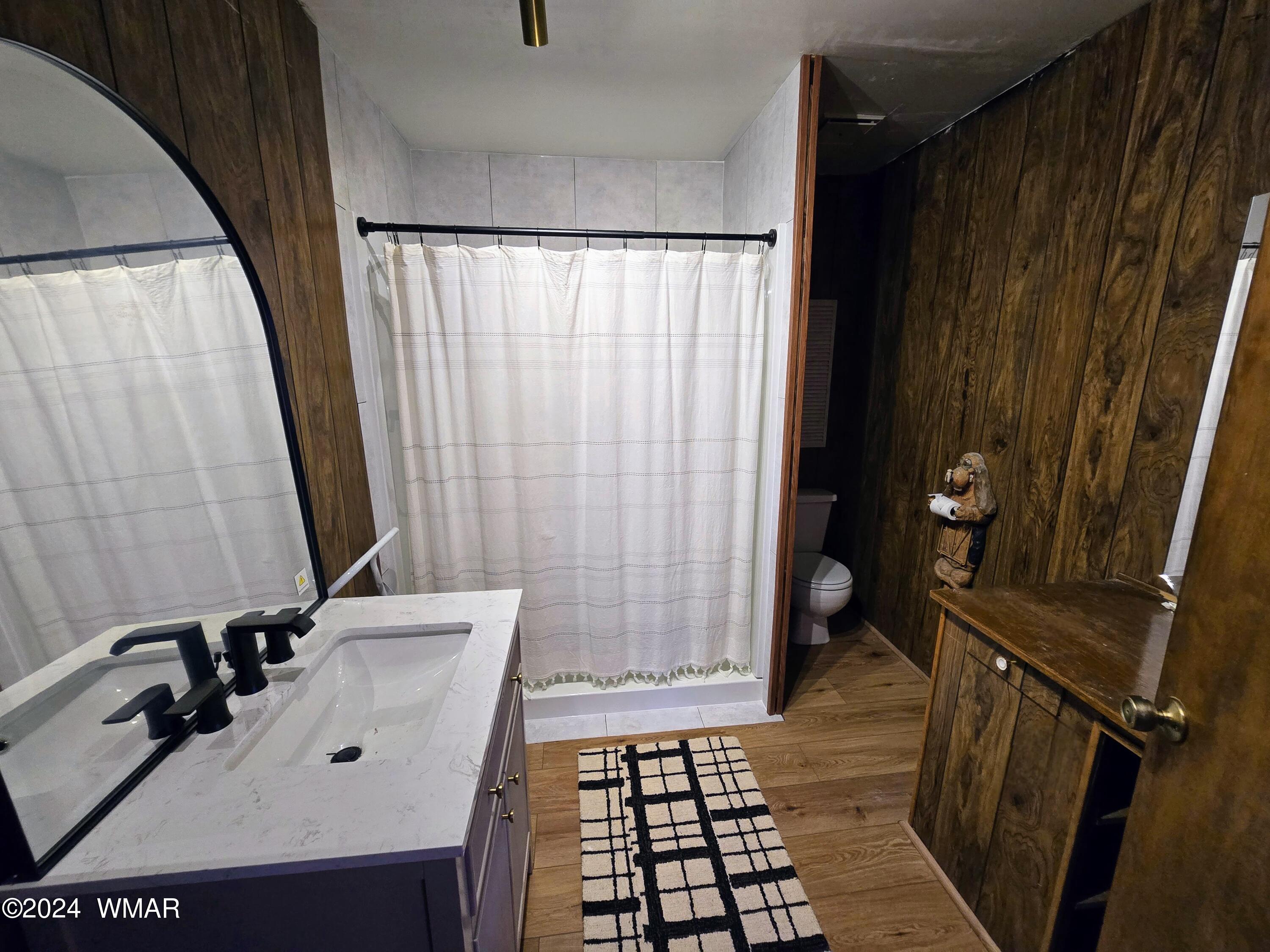 3058 Aspen Road Overgaard, AZ 85933 - Photo 7 of 15 a bathroom with a sink a mirror and shower