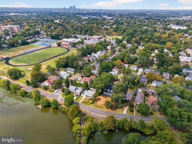 an aerial view of city and lake