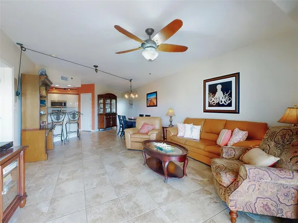 a kitchen with stainless steel appliances granite countertop a refrigerator and a stove