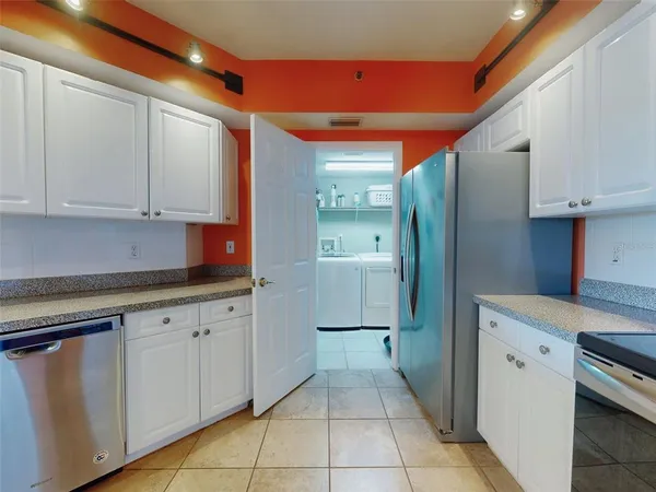 a bedroom with a bed and a dresser in it