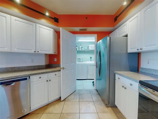 a bedroom with a bed and a dresser in it