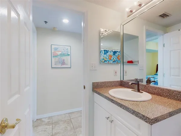a view of a deck with table and chairs potted plants with wooden floor