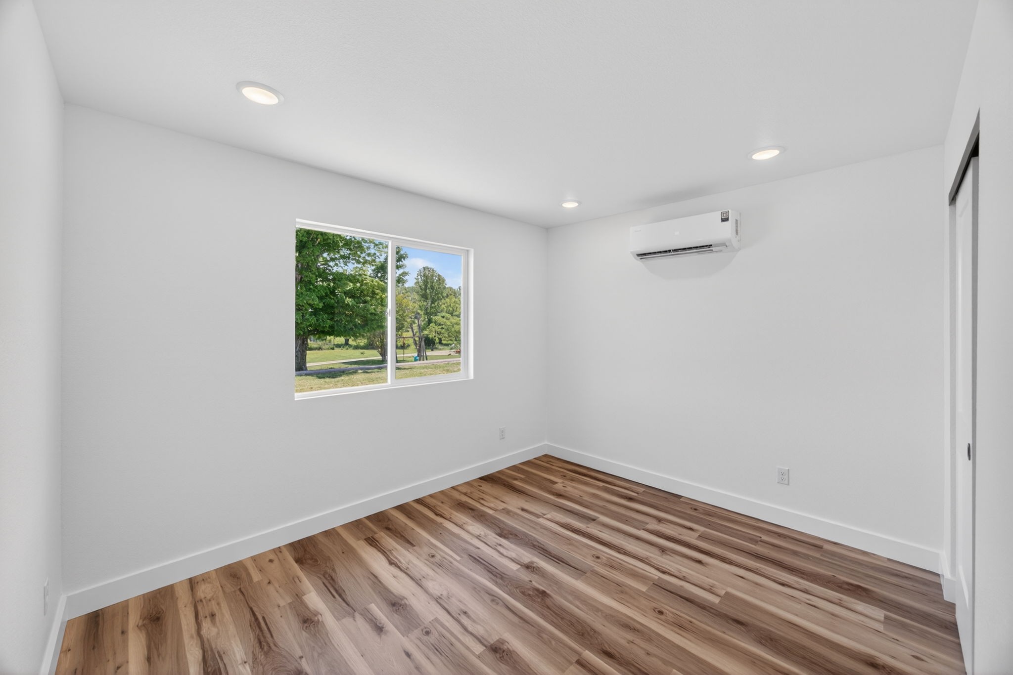 116 Bill Storie Road Byrdstown, TN 38549 - Photo 13 of 32 a view of room with window and hardwood floor