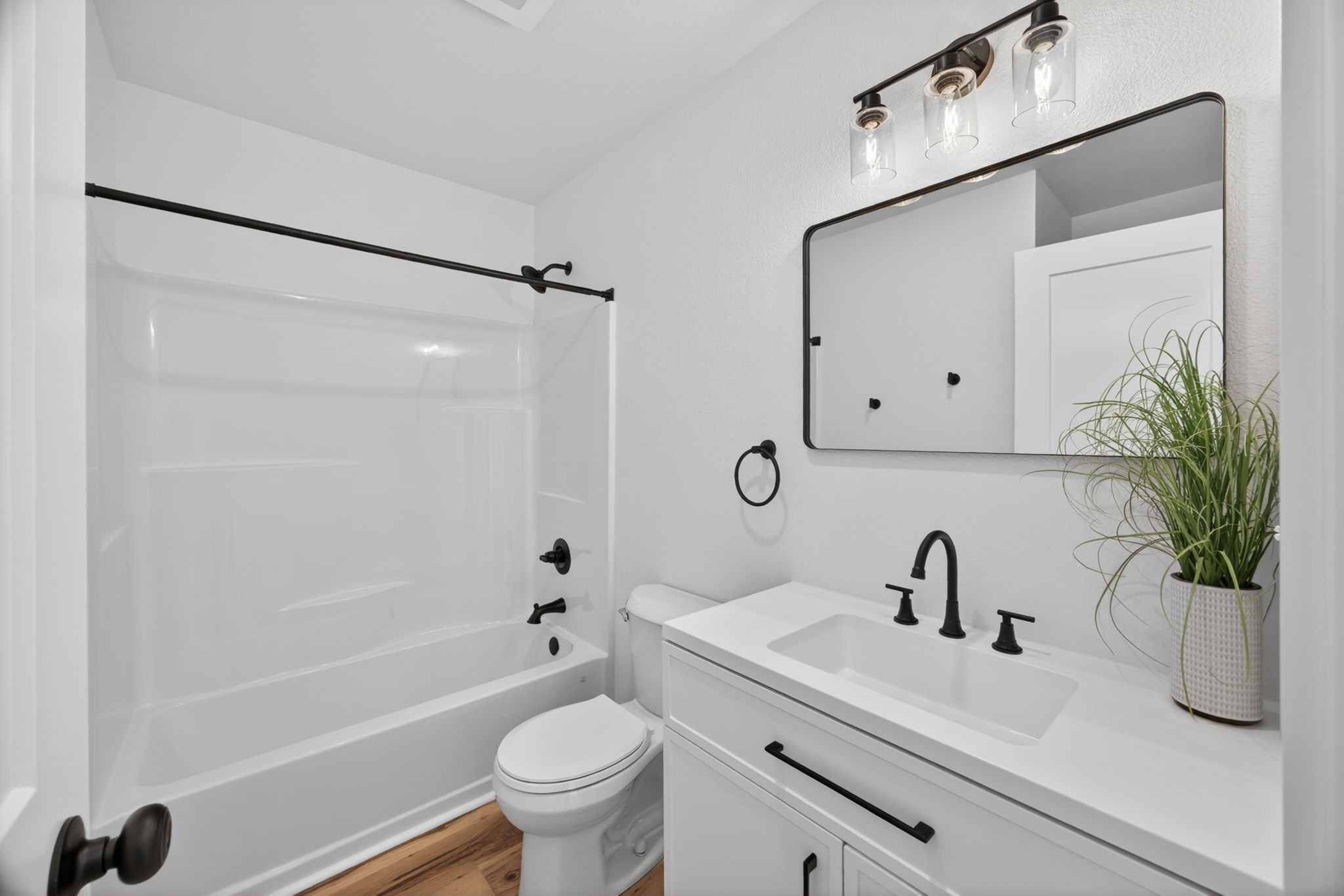116 Bill Storie Road Byrdstown, TN 38549 - Photo 15 of 32 a bathroom with a sink a mirror a toilet and a bathtub