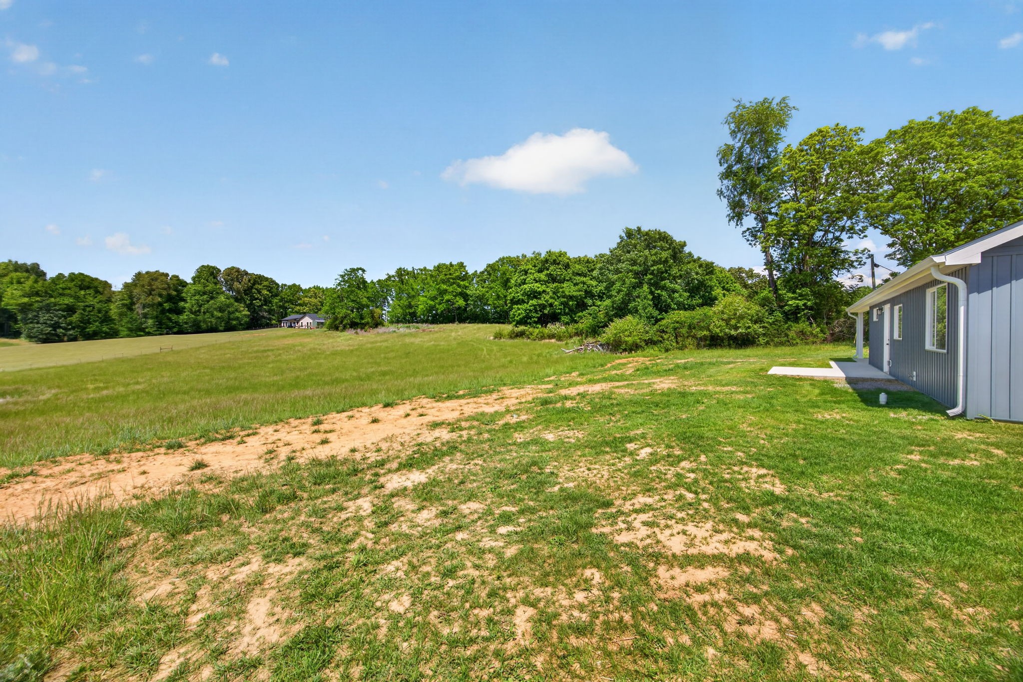 116 Bill Storie Road Byrdstown, TN 38549 - Photo 19 of 32 a view of a big yard with swimming pool and green space