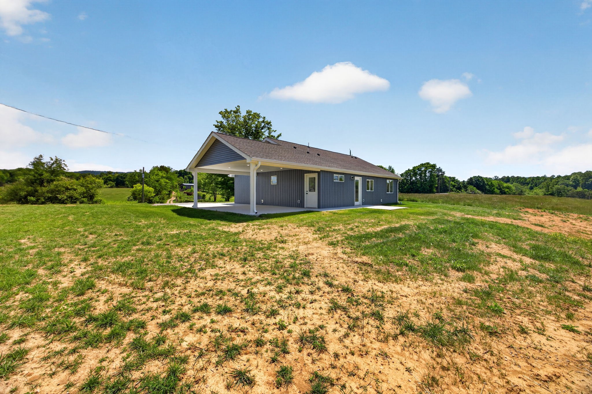 116 Bill Storie Road Byrdstown, TN 38549 - Photo 20 of 32 a view of a house with a yard