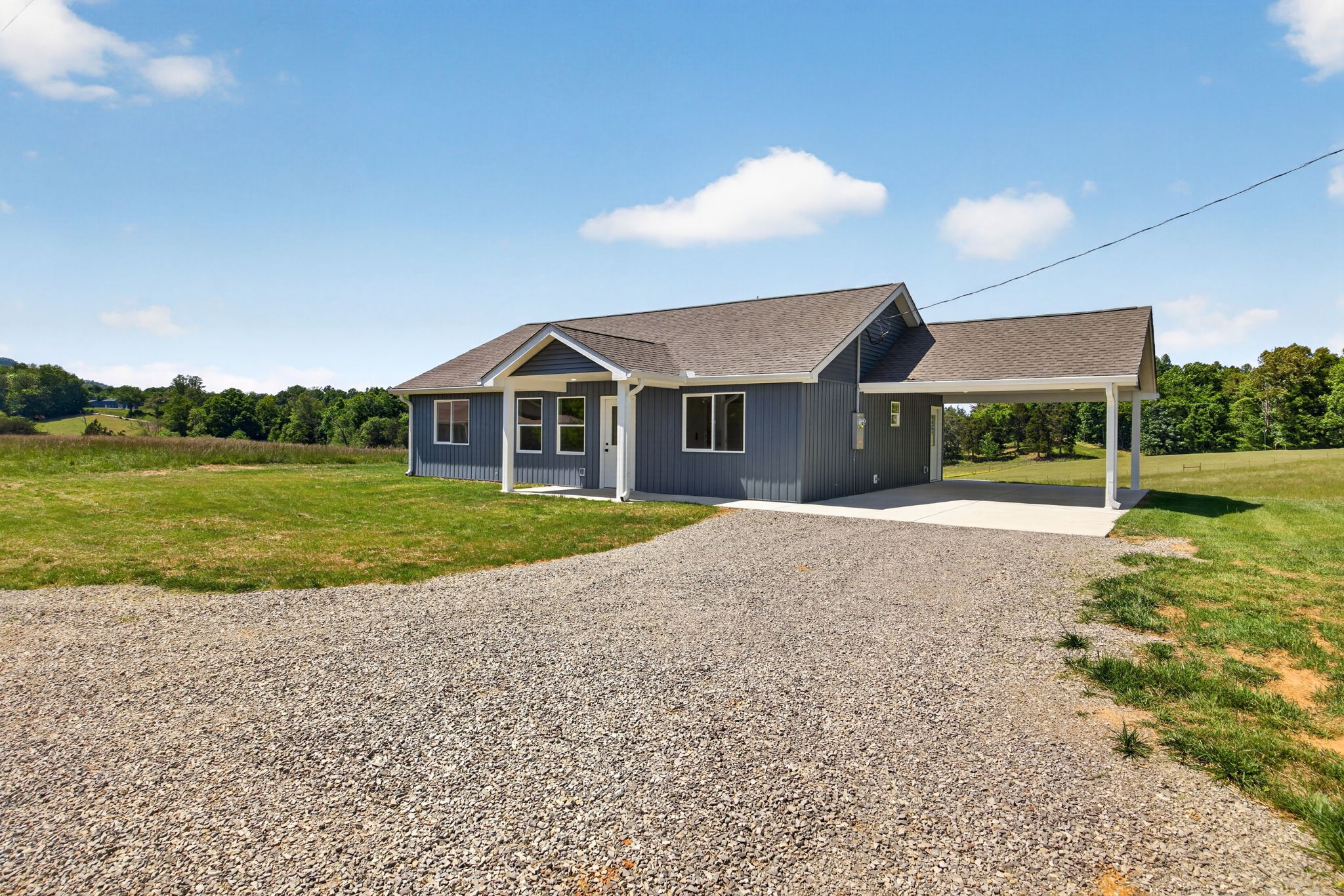 116 Bill Storie Road Byrdstown, TN 38549 - Photo 24 of 32 a front view of a house with a yard