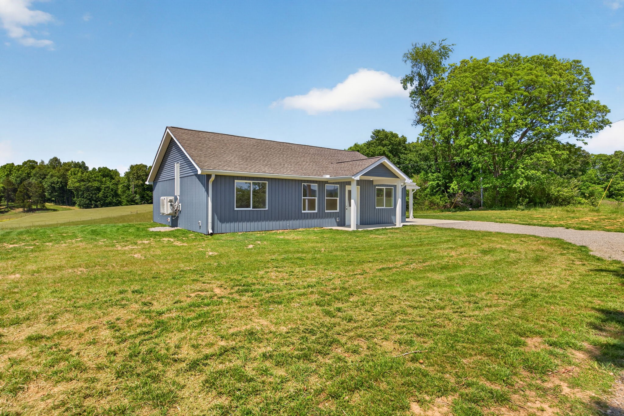 116 Bill Storie Road Byrdstown, TN 38549 - Photo 27 of 32 a front view of a house with a garden