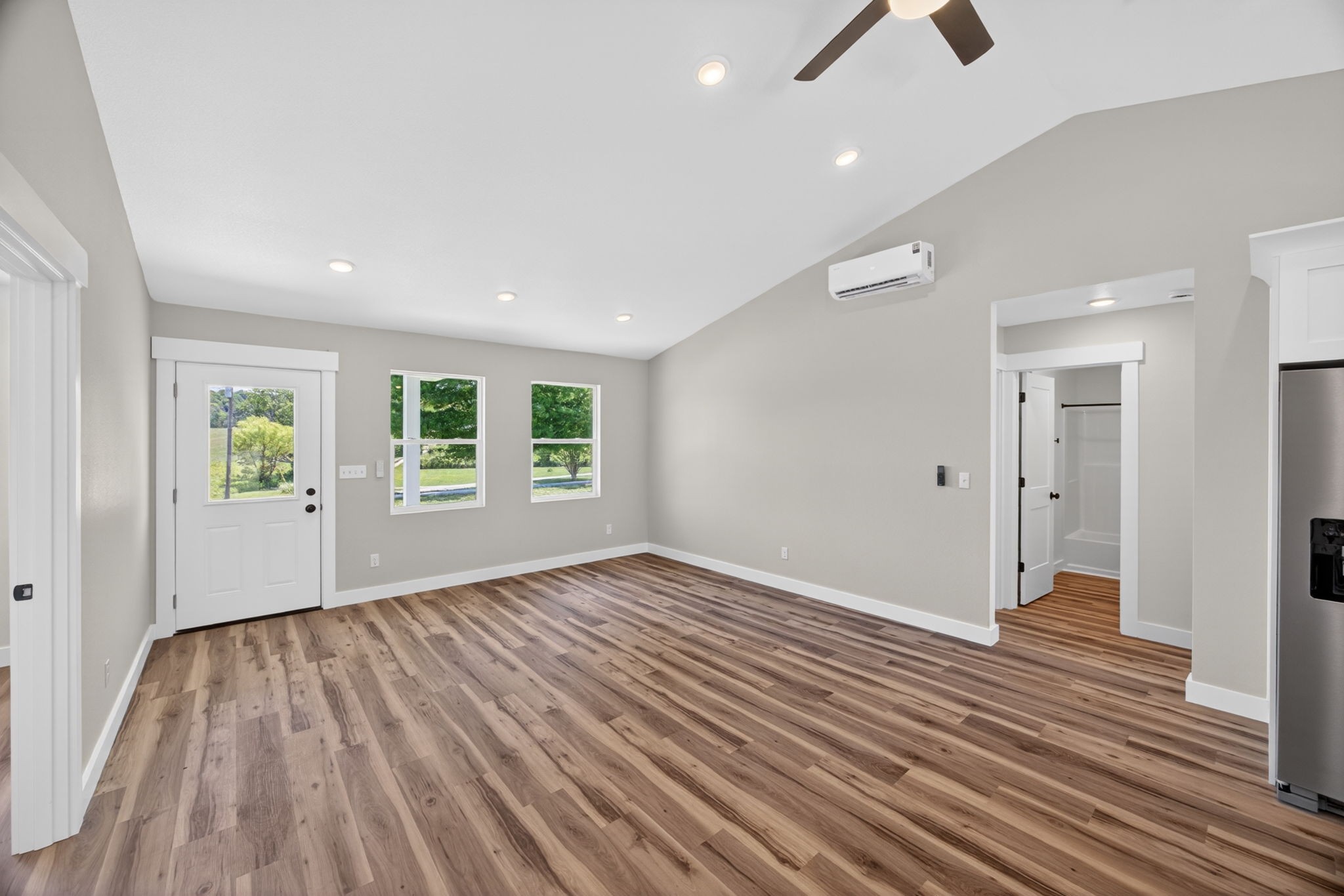116 Bill Storie Road Byrdstown, TN 38549 - Photo 6 of 32 wooden floor in an empty room with a window