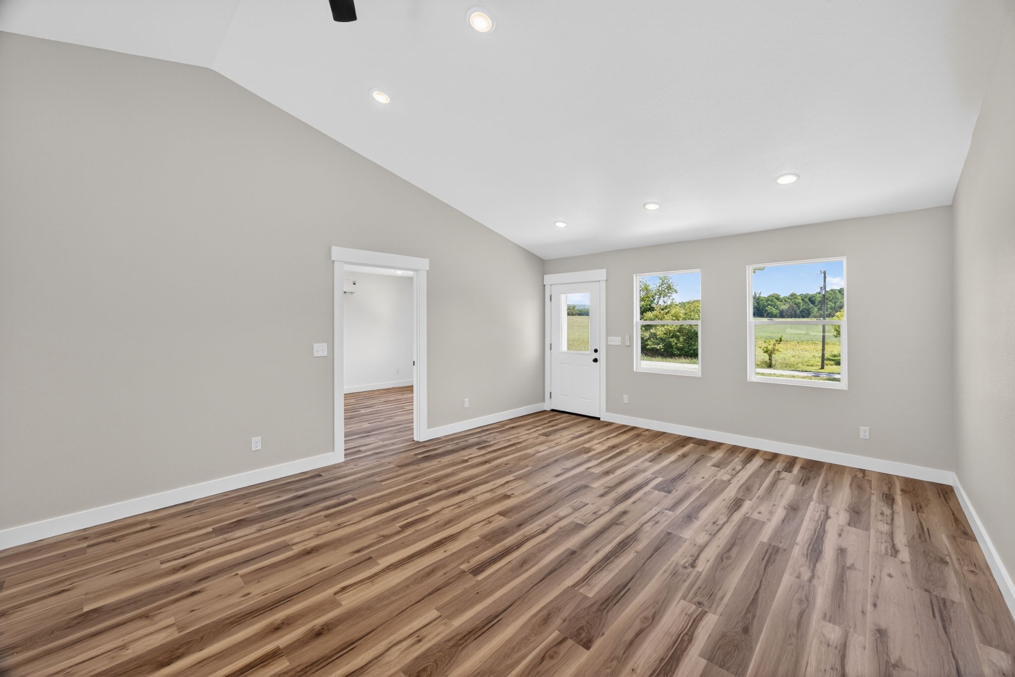 116 Bill Storie Road Byrdstown, TN 38549 - Photo 7 of 32 a view of an empty room with wooden floor and a window