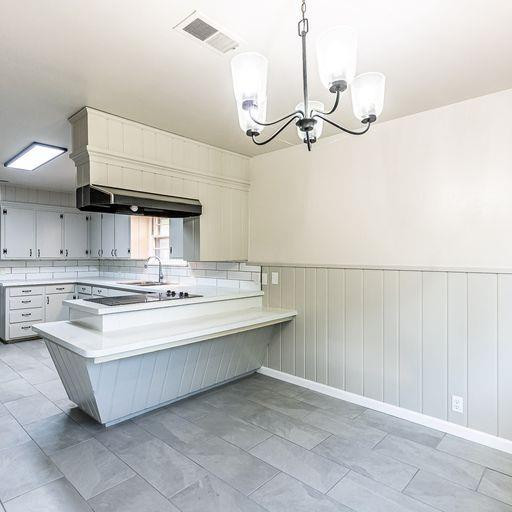 2110 65th Street Lubbock, TX 79412 - Photo 11 of 37 a bathroom with a sink a mirror and a shower