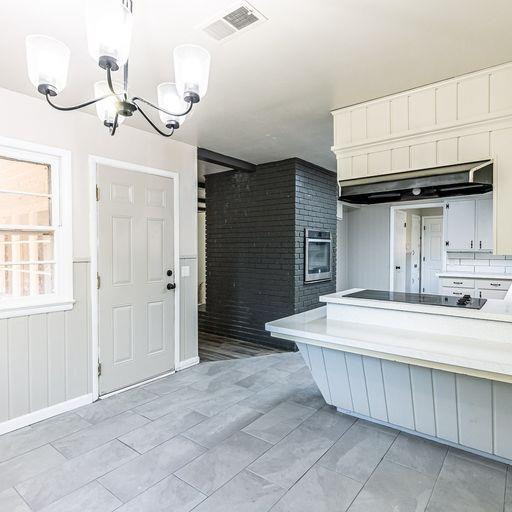 2110 65th Street Lubbock, TX 79412 - Photo 12 of 37 a spacious bathroom with a sink vanity and a mirror