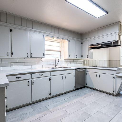 2110 65th Street Lubbock, TX 79412 - Photo 17 of 37 a kitchen with sink cabinets and a window
