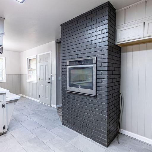 2110 65th Street Lubbock, TX 79412 - Photo 20 of 37 a view of an empty room and fire place