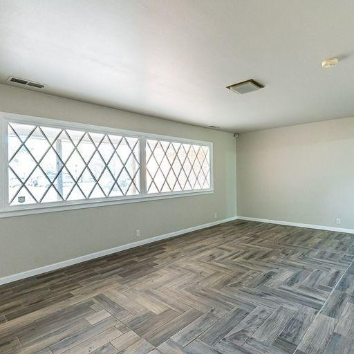 2110 65th Street Lubbock, TX 79412 - Photo 4 of 37 a view of an empty room and a window