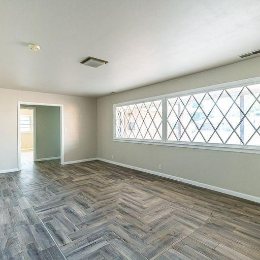 2110 65th Street Lubbock, TX 79412 - Photo 10 of 37 a view of an empty room and window