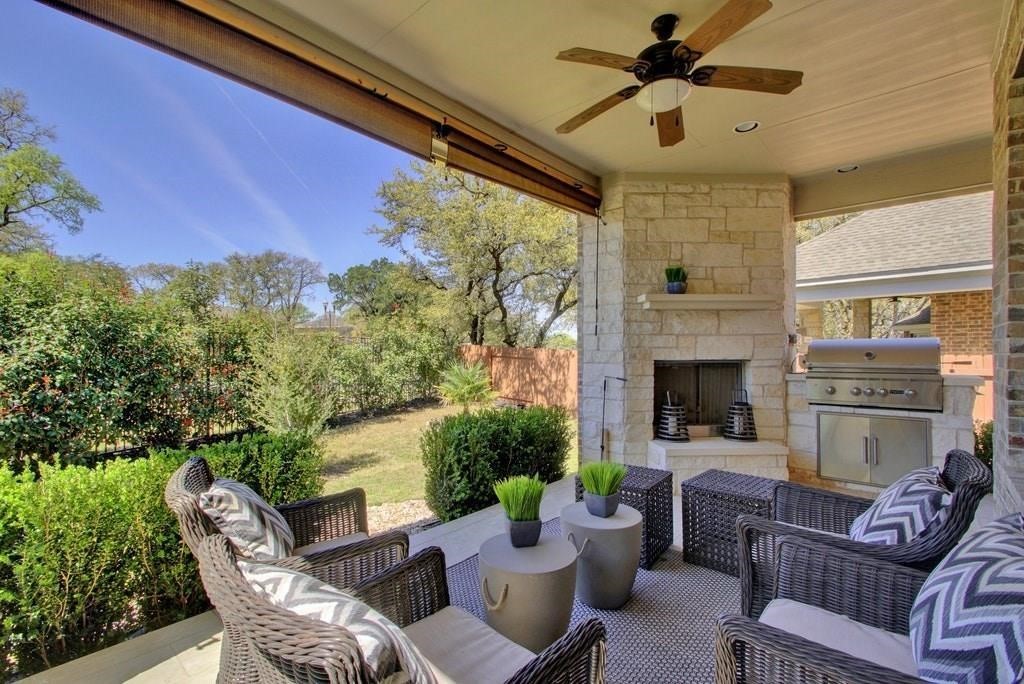 10825 Ballard Path Austin, TX 78717 - Photo 36 of 39 a living room with furniture a fireplace and a potted plant