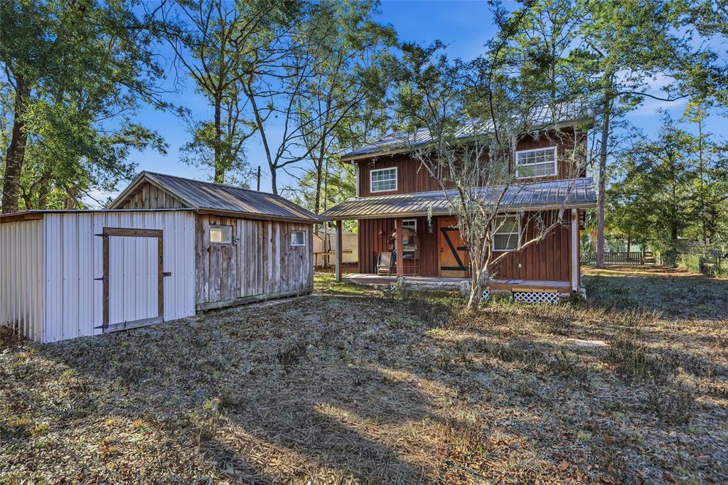 317 Cedar Street Steinhatchee, FL 32359 - Photo 21 of 32 a view of a house with a yard