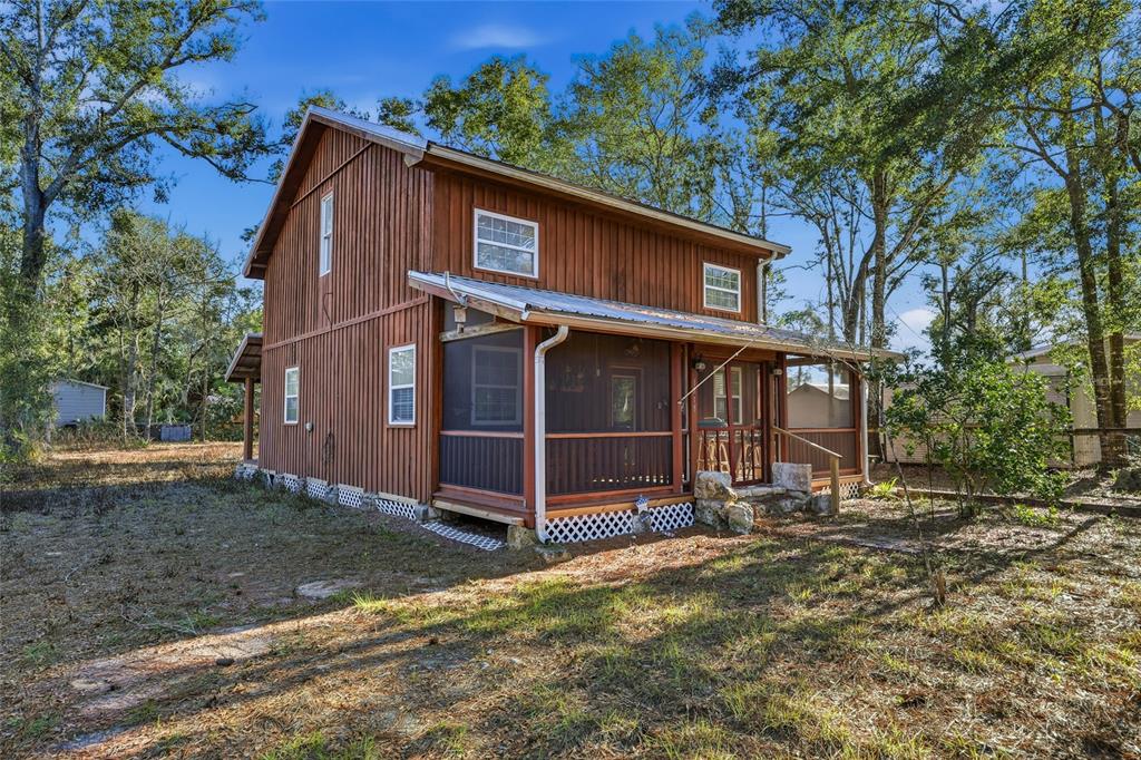 317 Cedar Street Steinhatchee, FL 32359 - Photo 22 of 32 a view of a house with a yard