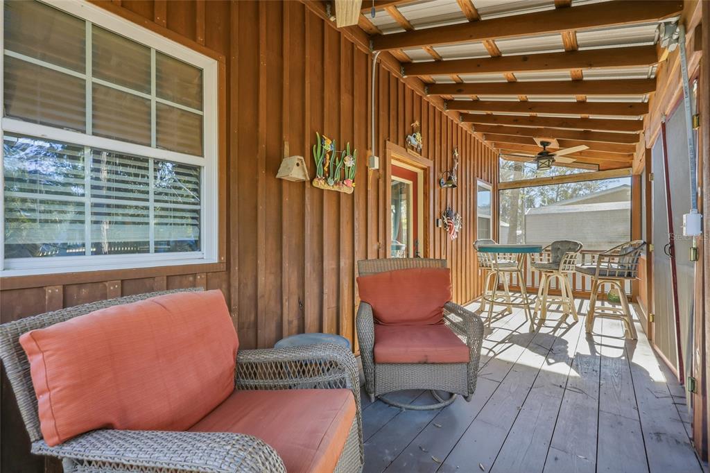 317 Cedar Street Steinhatchee, FL 32359 - Photo 4 of 32 a outdoor sitting area with furniture and wooden floor
