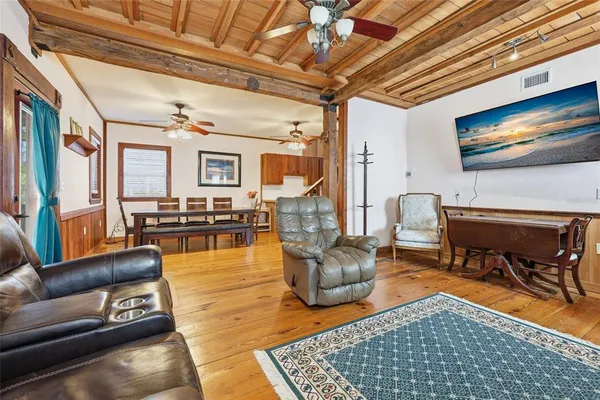 a living room with furniture and a rug