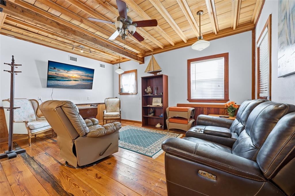 317 Cedar Street Steinhatchee, FL 32359 - Photo 7 of 32 a living room with furniture and a flat screen tv
